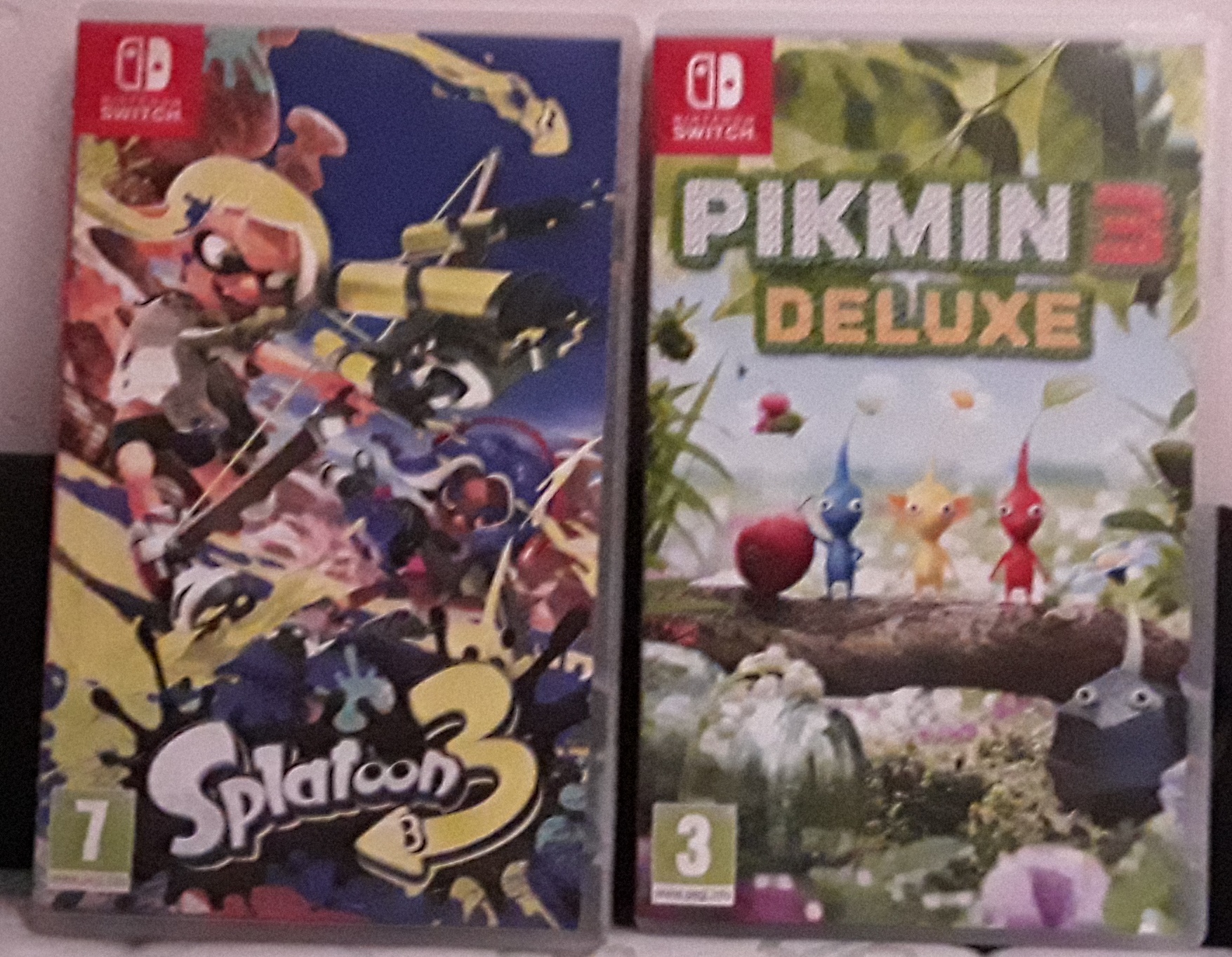 The boxes of Splatoon 3 and Pikmin 3 Deluxe