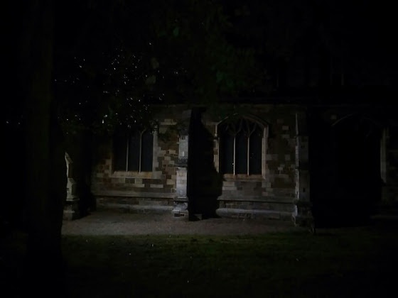 Spooky chuch and leaves at the dead of night