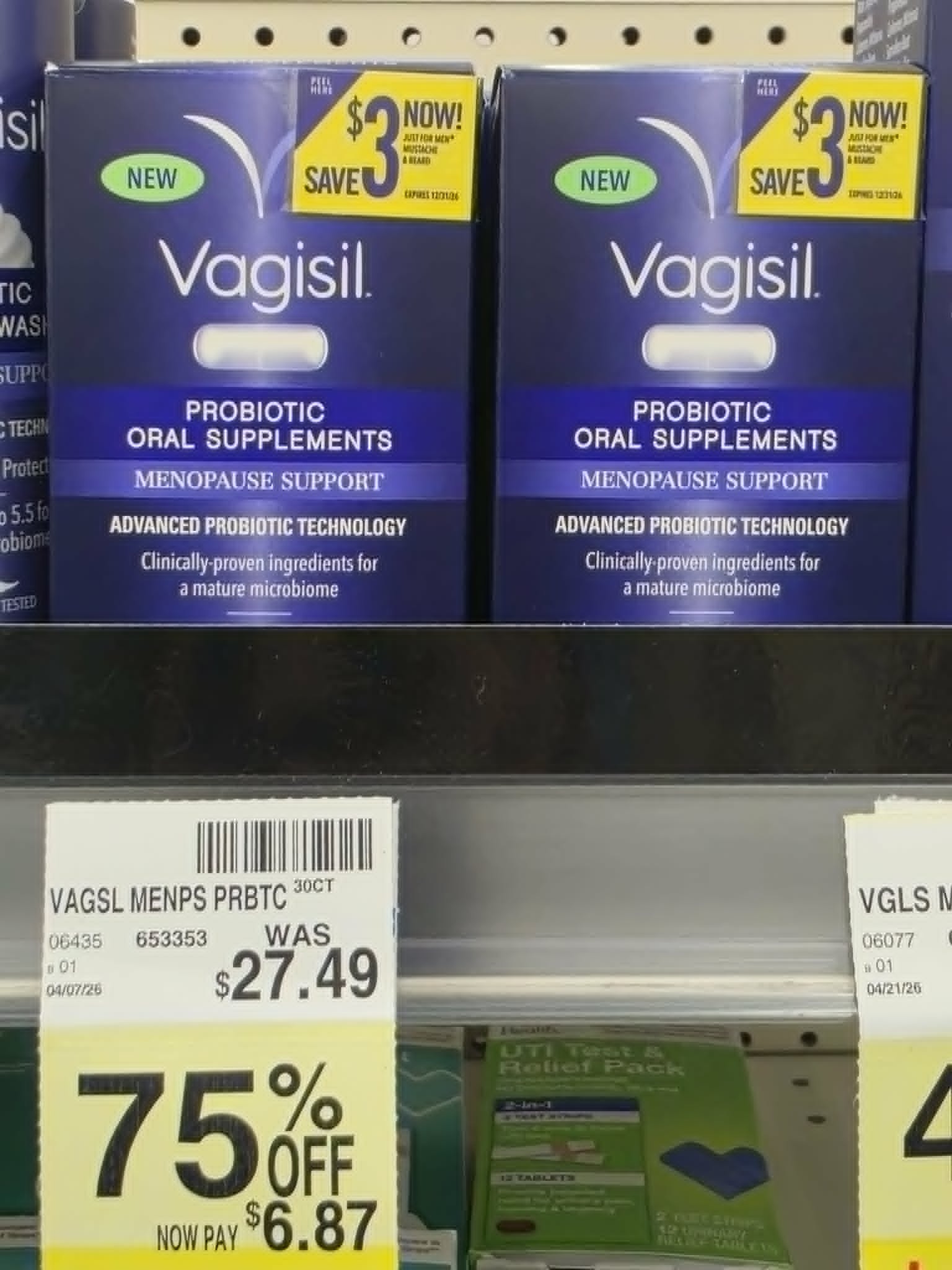 two boxes of Vagisil probiotic oral supplements for menopause support on a store shelf with a yellow clearance tag showing 75% off, reduced from $27.49 to $6.87