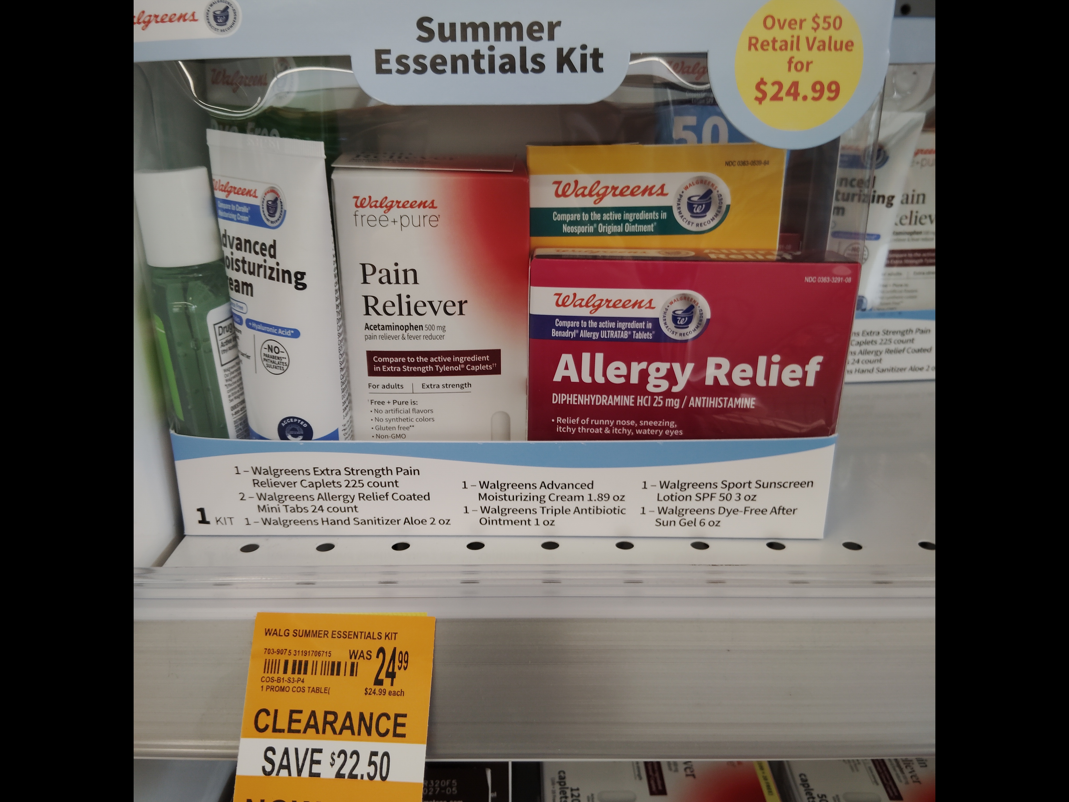 Walgreens Summer Essentials Kit on clearance. The kit includes Walgreens brand products such as Advanced Moisturizing Cream, Pain Reliever, Allergy Relief, Hand Sanitizer, Sport Sunscreen, and After Sun Gel. The label lists “Over $50 Retail Value for $24.99,” and a clearance tag below shows “Save $22.50” with the new price of $2.49.