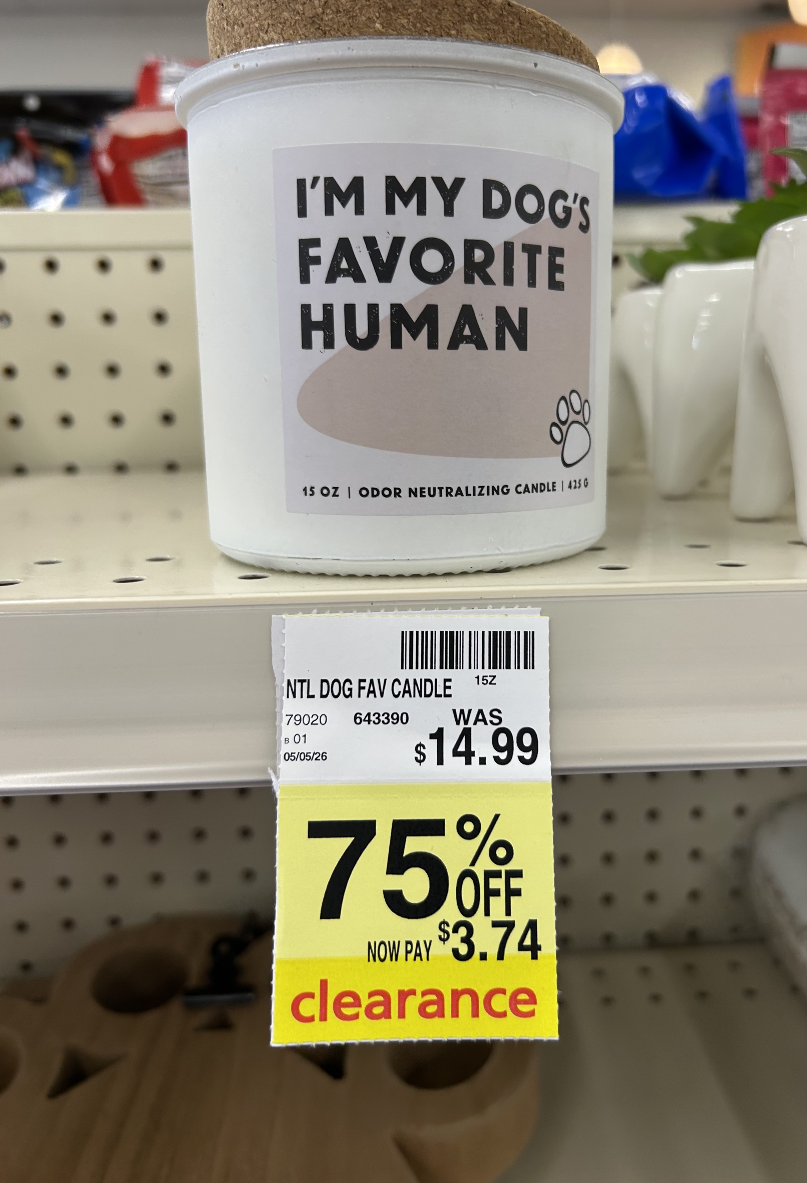 white “i’m my dog’s favorite human” odor neutralizing candle with cork lid on cvs clearance for $3.74, regularly $14.99