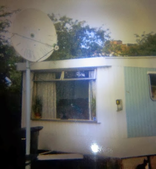 patio table sized satellite dish on motorway 17ft light pole sank next to old caravan shack
